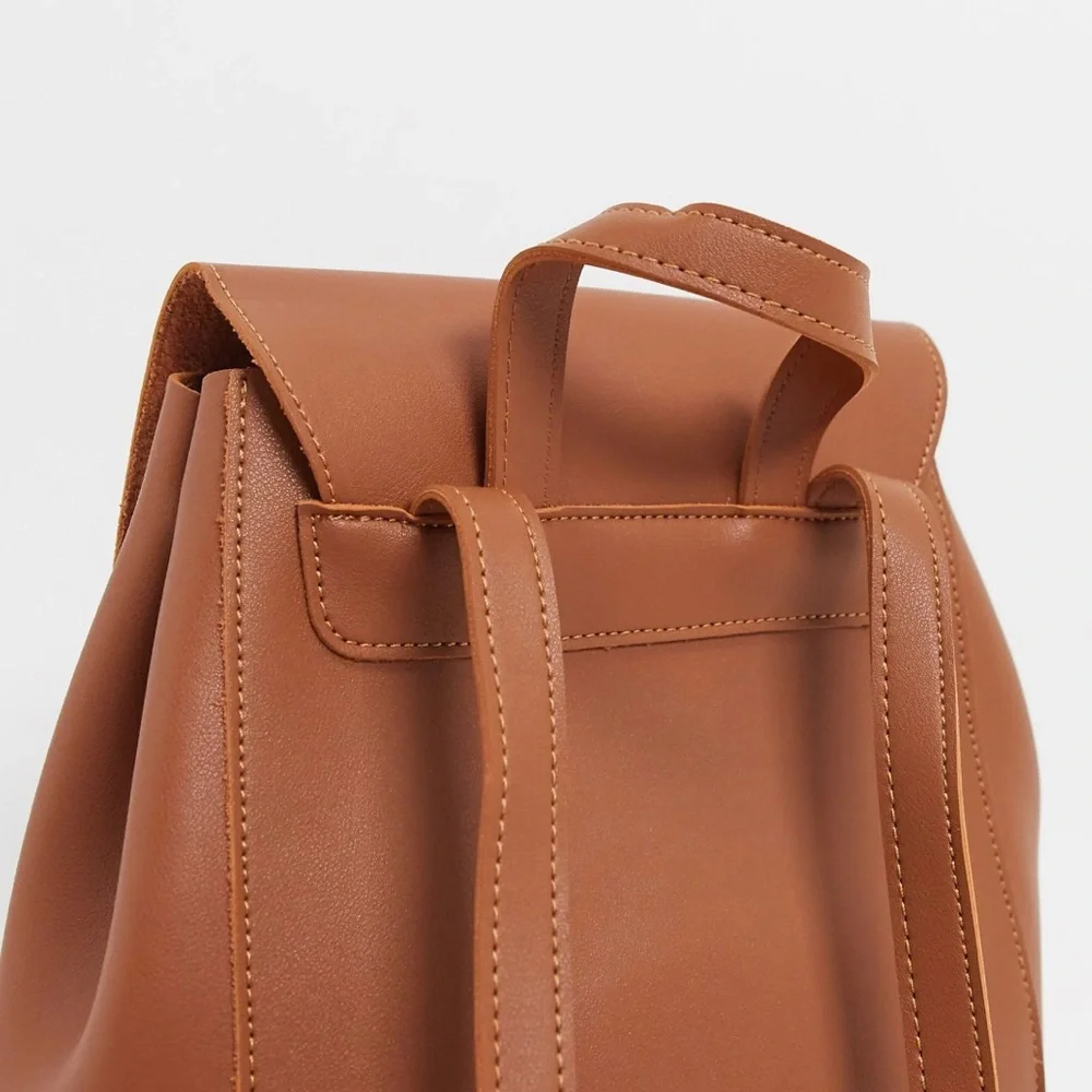 Claudia Canova Unlined Flapover Backpack Tan Faux Leather Minimalist